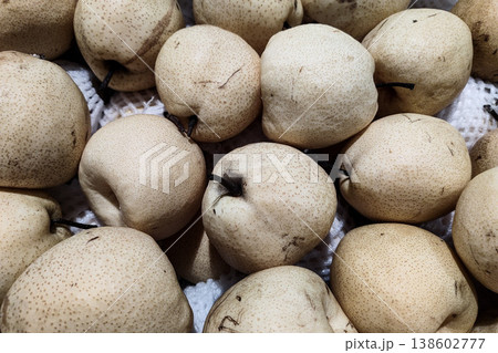 Fresh and Organic Pears Piled Together for Natural Food Presentation, Ideal for Healthy Eating and Culinary Uses in Stock Photography 138602777