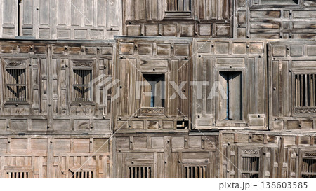 Traditional Thai style wooden house wall texture with antique windows. Traditional Thai style wooden house wall texture with antique windows. 138603585