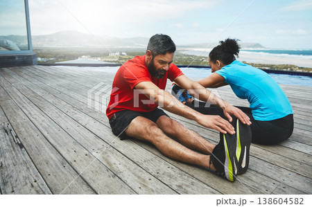 Stretching, legs and couple in exercise at beach to start fitness, training or outdoor on deck. Workout, back and stretch feet with people together in preparation for sports, performance and wellness Stretching, legs and couple in exercise at beach to start fitness, training or outdoor on deck. Workout, back and stretch feet with people together in preparation for sports, performance and wellness 138604582