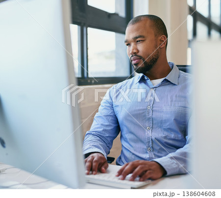 Business, thinking and black man with a computer, internet and solution with problem solving, planning and ideas. African person, employee and worker with tech, laptop and brainstorming with typing Business, thinking and black man with a computer, internet and solution with problem solving, planning and ideas. African person, employee and worker with tech, laptop and brainstorming with typing 138604608