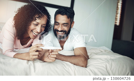 Couple, happy and bedroom with pregnancy test, positive and bed with smile, results and excited. Man, woman and baby with stick, love and maternity for future family, surprise and pregnant together 138604726