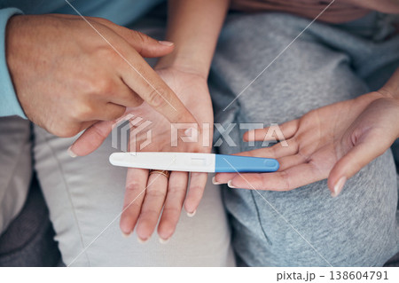 Hands, couple and closeup of pregnancy test, results and waiting for news together in home. Top view, kit and pregnant woman and man family planning for future maternity, ivf fertility and support Hands, couple and closeup of pregnancy test, results and waiting for news together in home. Top view, kit and pregnant woman and man family planning for future maternity, ivf fertility and support 138604791