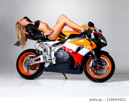 Sexy, leather jacket and woman in bikini on motorbike in studio isolated on a white background. Body, blonde model in swimsuit and motorcycle for fashion style, freedom to travel and beauty of legs 138604922