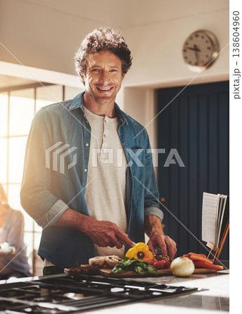 Smile, portrait and man chop vegetables in the kitchen for diet, healthy or nutrition dinner. Happy, cooking and mature male person from Canada cutting ingredients for a supper or lunch meal at home. Smile, portrait and man chop vegetables in the kitchen for diet, healthy or nutrition dinner. Happy, cooking and mature male person from Canada cutting ingredients for a supper or lunch meal at home. 138604960