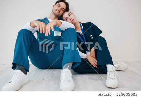 Sad doctors, hospital floor and woman with man, support and lost with regret, death and fail in surgery. Medic, partnership and burnout with depression, mistake or anxiety for healthcare in clinic Sad doctors, hospital floor and woman with man, support and lost with regret, death and fail in surgery. Medic, partnership and burnout with depression, mistake or anxiety for healthcare in clinic 138605085
