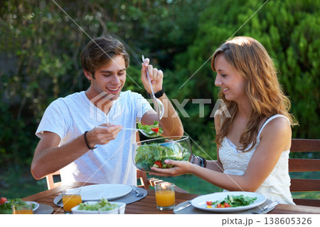 Happy, friends and food in backyard with salad at a table with hungry young people and smile. Lunch, home garden and group ready for eating with healthy meal together and relax outdoor of a house 138605326
