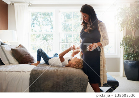 Happy family bedroom, pregnant woman and kid touch stomach, abdomen or belly for baby care, development or maternity. Mother, young girl and child check life growth, pregnancy or movement on home bed Happy family bedroom, pregnant woman and kid touch stomach, abdomen or belly for baby care, development or maternity. Mother, young girl and child check life growth, pregnancy or movement on home bed 138605330