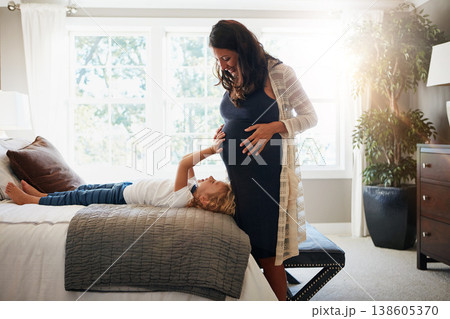 Home bedroom, pregnant woman and child touch, feel or massage stomach or excited for baby movement. Expectation, maternity and relax kid check life growth, pregnancy or belly of mother or mom on bed Home bedroom, pregnant woman and child touch, feel or massage stomach or excited for baby movement. Expectation, maternity and relax kid check life growth, pregnancy or belly of mother or mom on bed 138605370