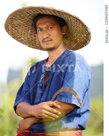 Asian man, portrait and straw hat of farmer for agriculture, wheat or harvest on rice field in nature. Male person or Thai with arms crossed on farm for professional harvesting, crops or natural land 138605484