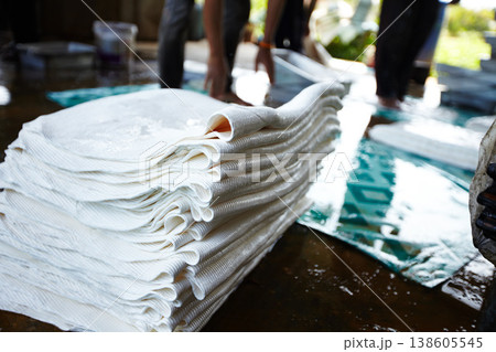 Rubber, manufacturing and closeup of sheet in workshop, factory and production warehouse. Sustainable business, industrial agriculture and equipment for rolling resource, plastic and natural material 138605545