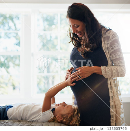 Home bedroom, pregnant woman and child touch, feel or massage stomach to check prenatal fetus movement. Expectation, mother and daughter curious for life growth, pregnancy or baby development on bed 138605766