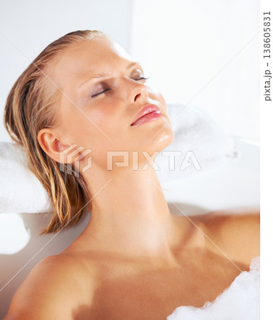 Relax, woman and bath with foam, skincare and beauty for hair and shampoo treatment at home. Morning, sleep and calm female person with cosmetics, soap and bubble in a bathroom with cleaning foam 138605831