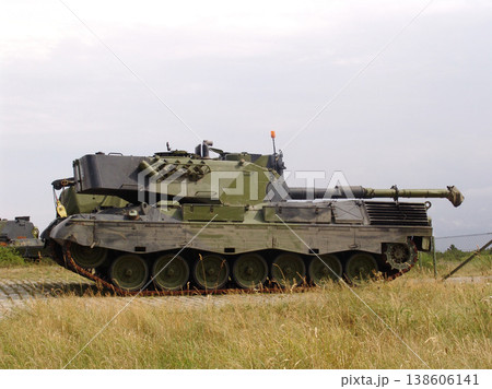 Military, nature and soldier transportation on field for warzone with a missile weapon in camouflage. Vehicle, landscape and army patrol service with gun for outdoor battle with conflict on land. Military, nature and soldier transportation on field for warzone with a missile weapon in camouflage. Vehicle, landscape and army patrol service with gun for outdoor battle with conflict on land. 138606141