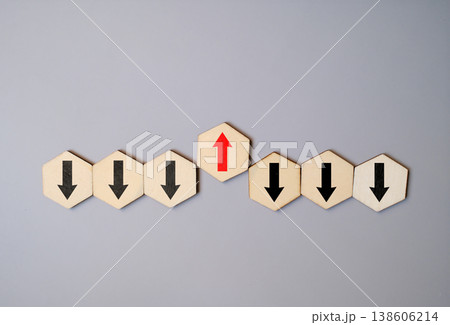 Individuality and bold direction concept with a red arrow pointing opposite to black arrows on wooden blocks Individuality and bold direction concept with a red arrow pointing opposite to black arrows on wooden blocks 138606214