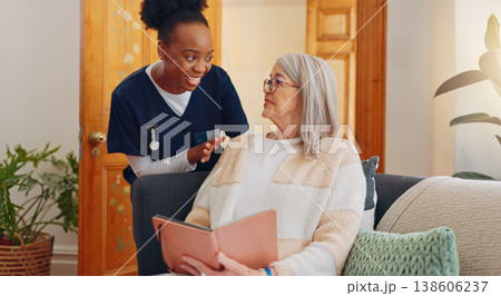 Tablet, nurse and senior woman on sofa reading notebook for checklist consultation research checkup. Bond, healthcare and African female caregiver talk to elderly patient grocery shopping list letter 138606237