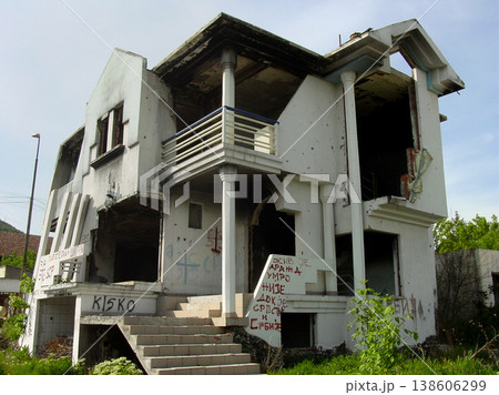 Abandoned, house and outdoor with war, ruins and destruction of countryside property from bomb disaster. Warzone, land or rubble of grunge apartment, building or old home with graffiti on wall Abandoned, house and outdoor with war, ruins and destruction of countryside property from bomb disaster. Warzone, land or rubble of grunge apartment, building or old home with graffiti on wall 138606299