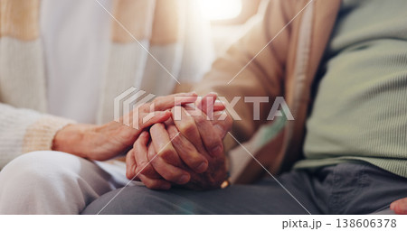 Holding hands, empathy and an elderly couple closeup in their home for love, support or trust in retirement. Hope, healing or sympathy with senior people on a sofa in the living room of their home 138606378