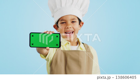 Chef kid, face or phone green screen in studio for social media, cooking tutorial ads or download. Blue background, space or happy child with notification for online marketing, mockup or advertising Chef kid, face or phone green screen in studio for social media, cooking tutorial ads or download. Blue background, space or happy child with notification for online marketing, mockup or advertising 138606405