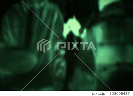 Military, target and green night vision, overlay or dark silhouette of spy, agent or terrorist risk to soldier. Police, surveillance or men training in infrared scope for army or security mission 138606427