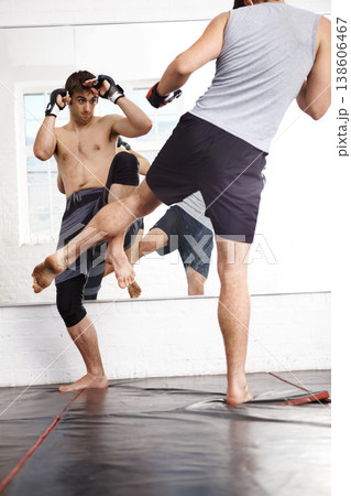 Kickboxing, MMA and men fight in gym, training and fitness with power, strong and martial arts for sport. Exercise, workout and athlete in dojo, competition or contest with boxer, action and muscle 138606467