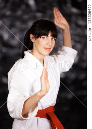 Woman, karate and portrait, fight pose and self defense sport with muay thai and training. Athlete, combat and power with fitness, martial arts and energy with warrior, exercise and taekwondo Woman, karate and portrait, fight pose and self defense sport with muay thai and training. Athlete, combat and power with fitness, martial arts and energy with warrior, exercise and taekwondo 138606490