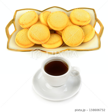 Delicious butter cookies on a decorative tray with a cup of black coffee. 138606732