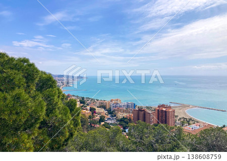 A winding hiking path leads to the historic fortress with walkable stone walls and sweeping panoramic city and coastal views in Malaga, Spain A winding hiking path leads to the historic fortress with walkable stone walls and sweeping panoramic city and coastal views in Malaga, Spain 138608759