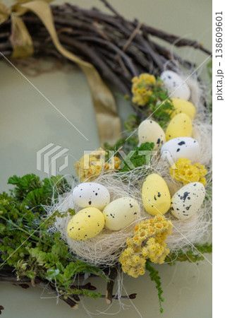 Handmade Easter wreath festive yellow egg decorations. Traditional holiday preparation craft creative decor. Sustainable responsible holiday gift workshop creation. Copy space Simple ideas 138609601