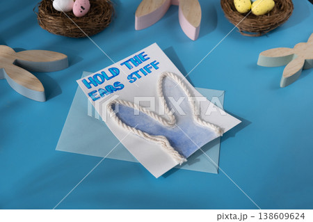 Handmade greeting card in colorful envelope letter with humor message HOLD THE EARS STIFF written in beautiful handwriting. Gesture shows excitement and joy for the upcoming event. Springtime holiday Handmade greeting card in colorful envelope letter with humor message HOLD THE EARS STIFF written in beautiful handwriting. Gesture shows excitement and joy for the upcoming event. Springtime holiday 138609624