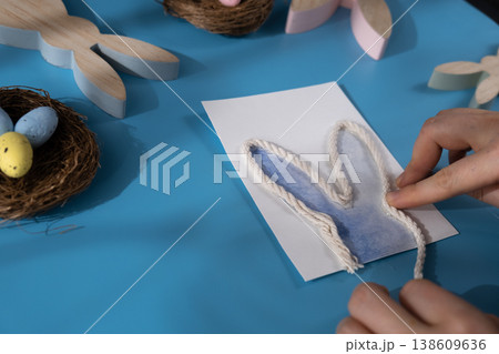 Painting Easter bunny rabbit handwritten words HOLD THE EARS STIFF Gift Easter idea. Do it yourself instruction postcard eco-friendly decoration. Making handmade art presents children's diy projects Painting Easter bunny rabbit handwritten words HOLD THE EARS STIFF Gift Easter idea. Do it yourself instruction postcard eco-friendly decoration. Making handmade art presents children's diy projects 138609636