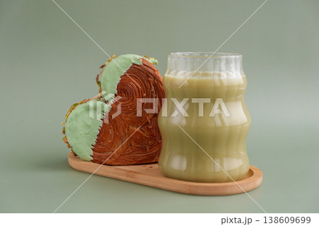 Drink beverage coffee cappuccino latte Delicious fresh croissant topped with Matcha Green Tea flavor Ganache. Creation unique heart shape bakery. Puff pastry holiday love gift present idea Valentine's Drink beverage coffee cappuccino latte Delicious fresh croissant topped with Matcha Green Tea flavor Ganache. Creation unique heart shape bakery. Puff pastry holiday love gift present idea Valentine's 138609699