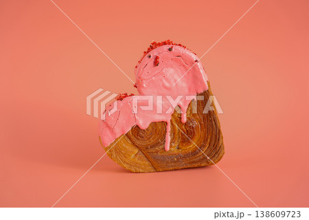 Heart shaped strawberry berry croissant on pink background with copy space. Puff pastry new trendy sweet dessert bakery. Creamy dough 138609723