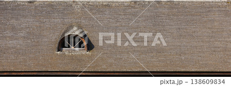 Background texture of a thatched roof showcasing an arched dormer window Background texture of a thatched roof showcasing an arched dormer window 138609834