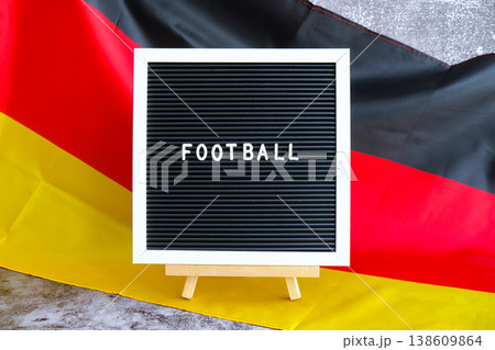 Lightbox with text STUDY IN GERMAN National symbol of Germany. German wave silky flag background. Education and learning  138609864