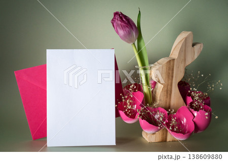 Easter mock up envelope empty card template Creative vibrant handmade Easter table decoration with egg shells wooden bunny on pastel green background copy space. Greeting card idea Easter home Easter mock up envelope empty card template Creative vibrant handmade Easter table decoration with egg shells wooden bunny on pastel green background copy space. Greeting card idea Easter home 138609880