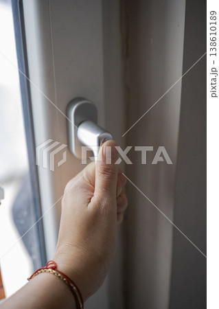 Close up of hand that opening window Close up of hand that opening window 138610189