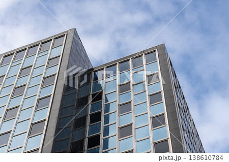 Skyscraper building architecture. Skyscraper with glassy exterior. Modern city perspective. Skyscraper in business city. City downtown with skyscraper in perspective. Perspective view Skyscraper building architecture. Skyscraper with glassy exterior. Modern city perspective. Skyscraper in business city. City downtown with skyscraper in perspective. Perspective view 138610784