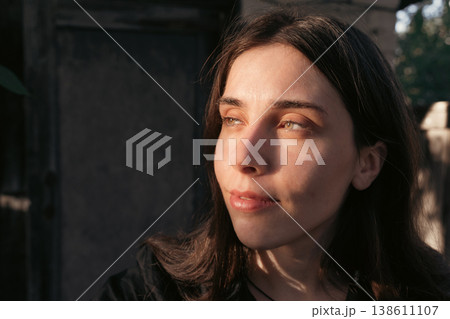 Young woman portrait in warm golden sunlight outdoors 138611107