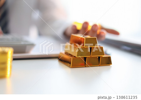 Gold Trading Businessman invest in trading gold, calculating profit price of buy and sell gold. Gold Trading Businessman invest in trading gold, calculating profit price of buy and sell gold. 138611235