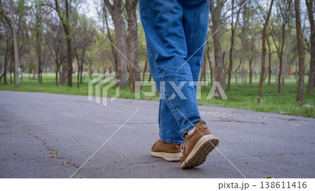 Girl walking in the park 138611416