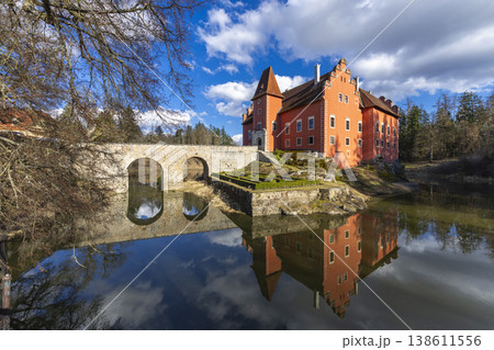 Cervena Lhota water castle reflecting on calm water 138611556