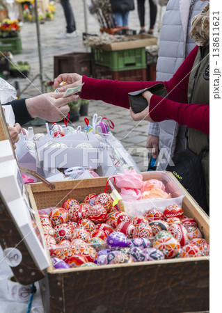 Buyer paying for traditional Czech Easter eggs at Zelny trh, Brno Buyer paying for traditional Czech Easter eggs at Zelny trh, Brno 138611621