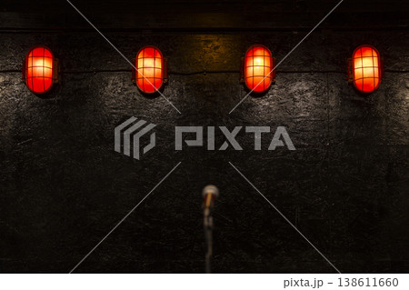 Microphone on stage with red lights ambiance Microphone on stage with red lights ambiance 138611660