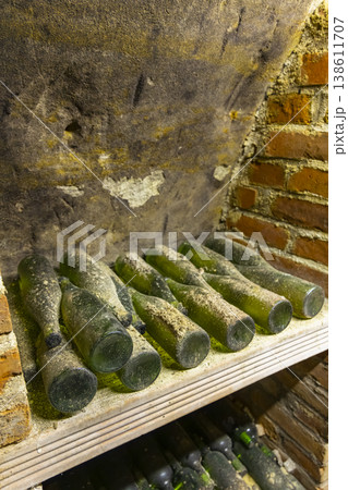 Green wine bottles aging in traditional Znojmo cellar Green wine bottles aging in traditional Znojmo cellar 138611707