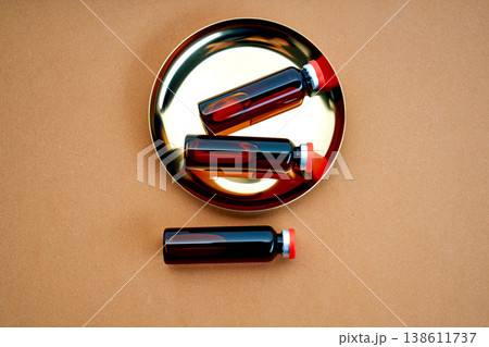 Medicine vials on a golden tray preparing liquid drug 138611737