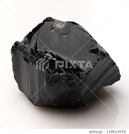 Large Polished Black Obsidian Crystal Fragment with Smooth Glassy Surfaces and Sharp Natural Fractures on White 138612058