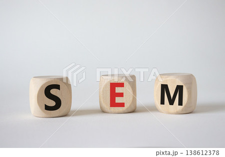 SEM - Search Engine Marketing symbol. Wooden cubes with words SEM. Beautiful white background. Business and SEM concept. Copy space. SEM - Search Engine Marketing symbol. Wooden cubes with words SEM. Beautiful white background. Business and SEM concept. Copy space. 138612378