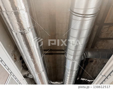 Industrial ventilation system and air ducts installed on concrete ceiling in modern building. Industrial ventilation system and air ducts installed on concrete ceiling in modern building. 138612517