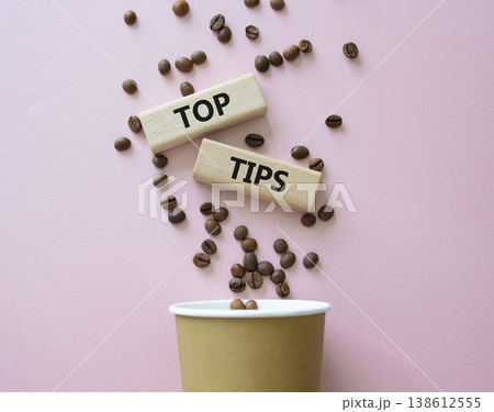 Top Tips symbol. Wooden blocks with words Top Tips. Beautiful pink background with coffee cup and coffee beans. Business and Top Tips concept. Copy space. Top Tips symbol. Wooden blocks with words Top Tips. Beautiful pink background with coffee cup and coffee beans. Business and Top Tips concept. Copy space. 138612555