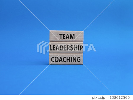 Team leadership coaching symbol. Concept word Team leadership coaching on wooden blocks. Beautiful blue background. Business and Team leadership coaching. Copy space 138612560
